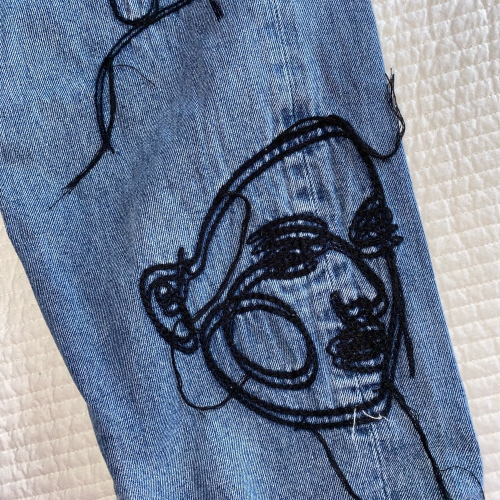 Graphic jeans. Size 8. Trendy and stylish. Never worn. New with tag